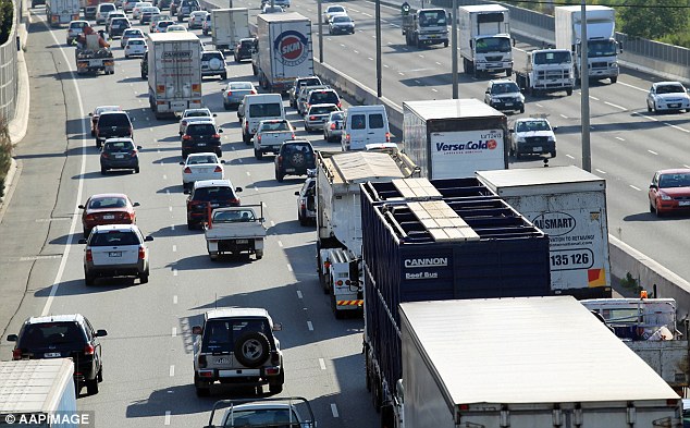 The net annual immigration pace of 262,489, factoring in people moving overseas, was the highest in 13 years (Melbourne's busy Monash freeway pictured)