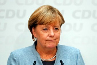 Angela Merkel addresses a news conference.