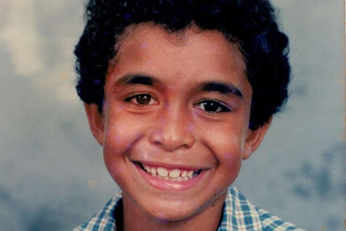 Daniel Love A photo of young Daniel Love, smiling and wearing a checked shirt.